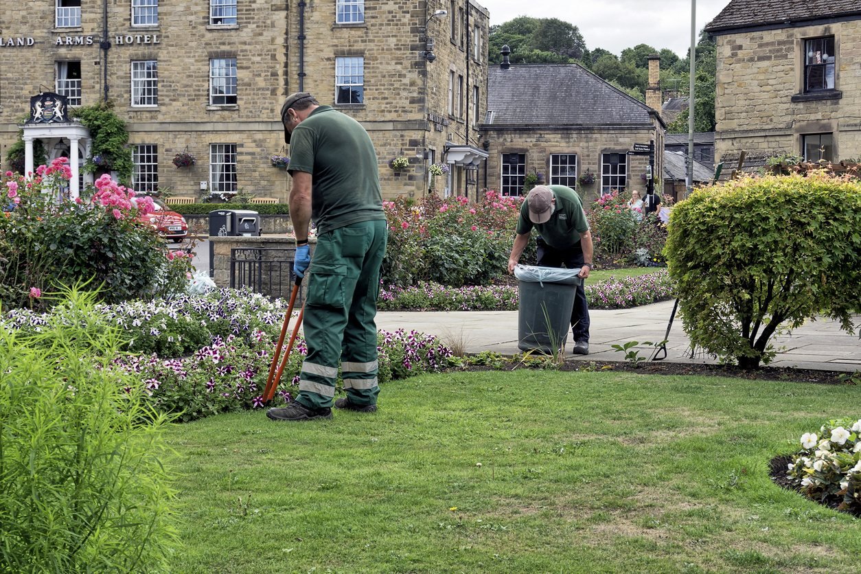 Grounds maintenance workers caring for a garden