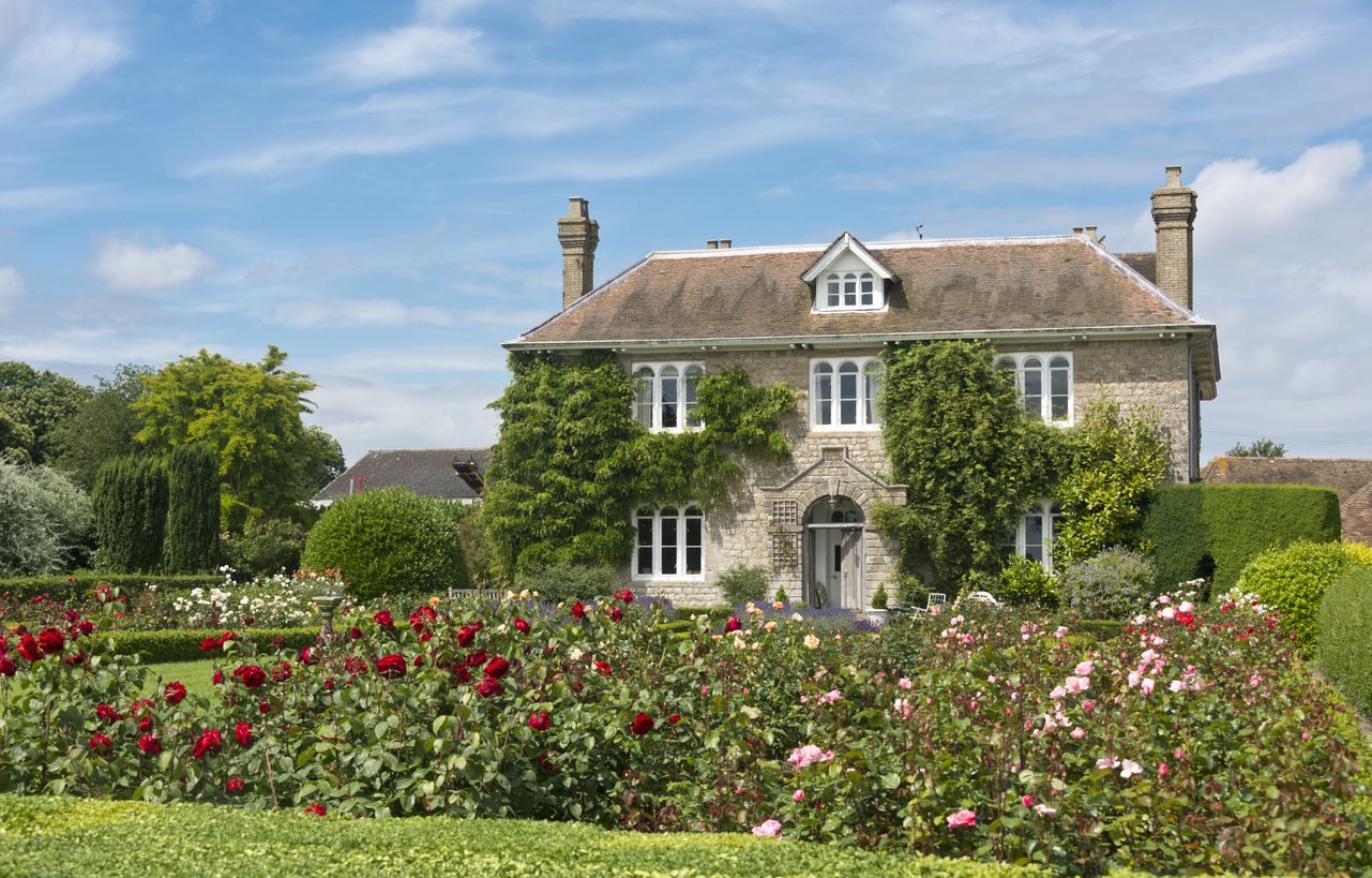 Flower borders in front of a country house